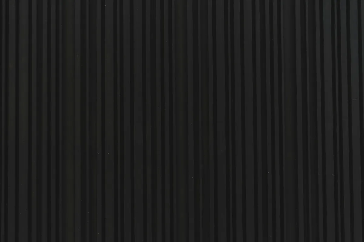 Dark charcoal architectural metal texture